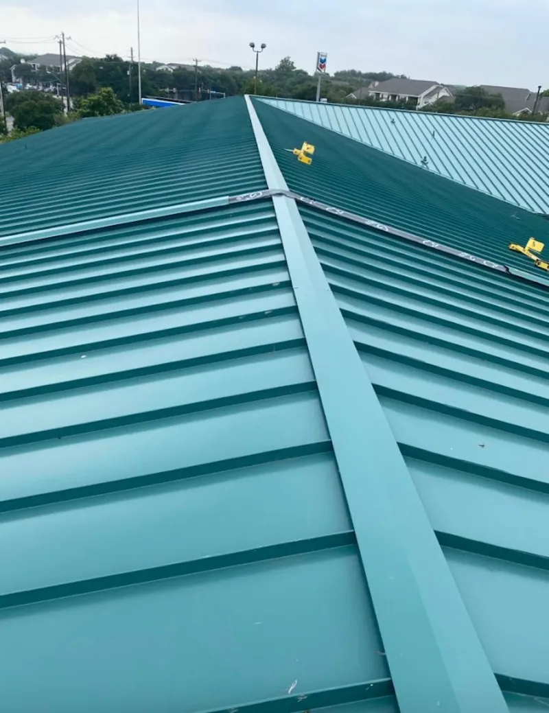 Green commercial metal roof ridge and valley for Metal Roof Repair in Sonterra
