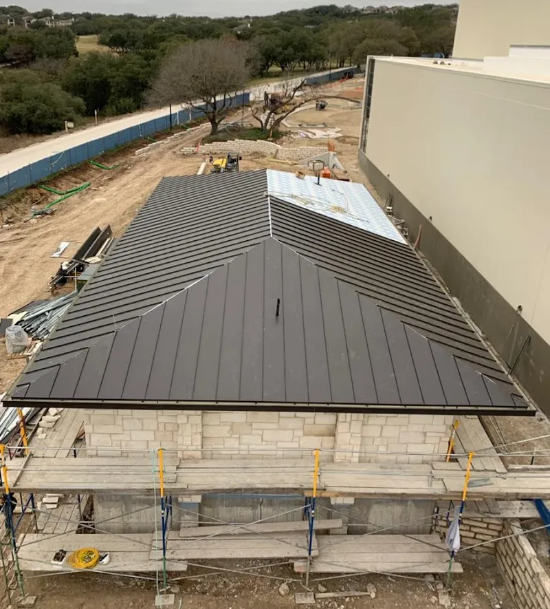 Metal roof new construction with scaffolding in Sonterra
