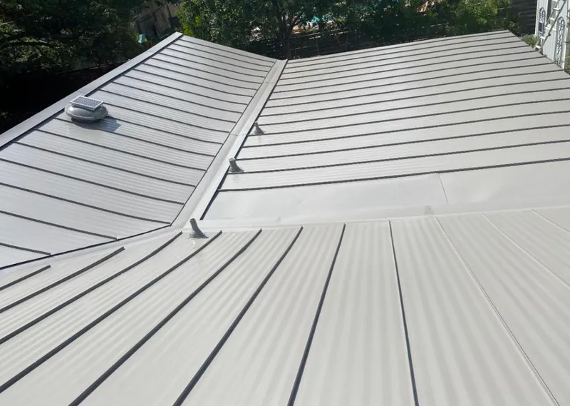 Solar attic fan installed on a metal roof for Roof Ventilation in Sonterra